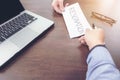 Image of businessman hand sending a resignation letter to executive boss with glasses, pen and laptop on a wooden table, Change Royalty Free Stock Photo