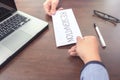 Image of businessman hand sending a resignation letter to executive boss with glasses, pen and laptop on a wooden table, Change Royalty Free Stock Photo