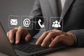 Virtual customer contact icon on laptop â Business person seeks support, sends email or calls hotline Royalty Free Stock Photo