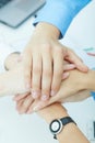 Image of businesspeople hands on top of each other as symbol of their partnership. Royalty Free Stock Photo