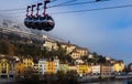 Image of cable cars in Grenoble in autumn over riverside