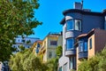 California residential housing top view of three apartment buildings with trees and clear blue sky