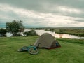 Image of camping side with tents and bicycles at the lake Royalty Free Stock Photo