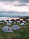Image of camping side with tents and bicycles at the lake Royalty Free Stock Photo