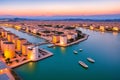 Capoterra, Cagliari, Sardinia. Silos at sunset in the Santa Gilla lagoon made with Generative AI