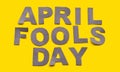 Image caption April Fools' Day made of grey paper letters on a yellow background close-up