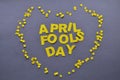 Image caption April Fools' Day yellow inside the heart of confetti on a grey background