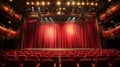 Red theater curtains with spotlights on stage and empty red velvet seats in auditorium Royalty Free Stock Photo