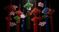 Vibrant Chinese lucky knots with tassels and flowers Royalty Free Stock Photo