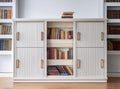 White Wooden Bookcase in Public Library with Colorful Books Royalty Free Stock Photo
