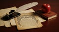 Quill ink and old parchment with a red apple book Royalty Free Stock Photo