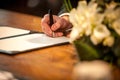 Nuptial Promise: Signing the Wedding Register Royalty Free Stock Photo