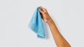 arm holding light blue microfiber cloth Royalty Free Stock Photo