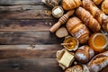 Assorted Baked Goods on Rustic Wooden Table - Cozy Bakery Scene Royalty Free Stock Photo