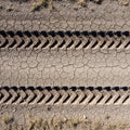 Tractor Tire Tracks on Dry Cracked Earth Royalty Free Stock Photo