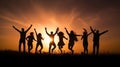 Silhouettes of people dancing at sunset Royalty Free Stock Photo