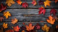 Rustic Autumn: Maple Leaves on Wood Background Royalty Free Stock Photo