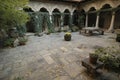 Stavropoleos monastery courtyard with ivy covered arches stone columns and scattered autumn leaves in Bucharest Romania Royalty Free Stock Photo