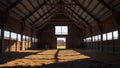 Interior View of an Empty Rustic Barn with Wooden Structure and Earthy Floor Royalty Free Stock Photo