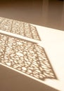 Geometric Shadow Play on Textured Wall and Floor Royalty Free Stock Photo