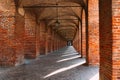 Symmetrical brick arcade in Sabbioneta, Italy, with long perspective Royalty Free Stock Photo