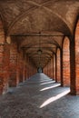 Symmetrical brick arcade in Sabbioneta, Italy, with long perspective Royalty Free Stock Photo