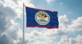 The national flag of belize waving proudly against a backdrop of fluffy white clouds and a blue sky Royalty Free Stock Photo
