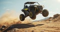 Black UTV jumps high kicking up dirt and dust Royalty Free Stock Photo
