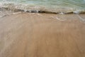 Gentle Waves Washing Ashore on Sandy Beach Royalty Free Stock Photo