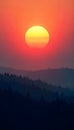 A beautiful sunset illuminates forested mountains with radiant colors in sky Royalty Free Stock Photo