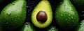 Close-Up of Fresh Avocados With Water Droplets on a Dark Surface Royalty Free Stock Photo