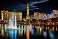 The image captures the vibrant lights and bustling energy of the iconic Las Vegas Strip at night, View of the Bellagio Fountains