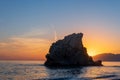 Image capturing the sunstar of the sun behind the rock of the crow, Malaga. Spain Royalty Free Stock Photo