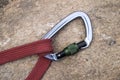 Image of a carabiner hook and red rope Royalty Free Stock Photo