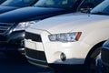 Cars in a parking lot in a row close up Royalty Free Stock Photo