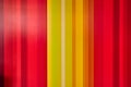 Cartoonish vertical yellow colored lines with red on outer edges abstract background asset