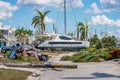 Image of a catamaran resting on a residential neighborhood street after Hurricane Ian Fort Myers FL