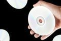 Image of cd disk hand dark background Royalty Free Stock Photo