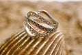 image of cheap used ring bijouterie on sea shell