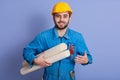 Image of cheerful inspired young worker with beard smiling sincerely, holding paper, having new plan of project, satisfied with Royalty Free Stock Photo