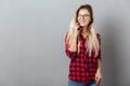 Cheerful young blonde woman talking by phone. Royalty Free Stock Photo