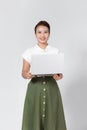 Image of cheerful young woman standing isolated over white background using laptop computer Royalty Free Stock Photo
