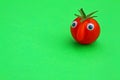 Cherry tomato with a funny face Royalty Free Stock Photo