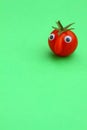 Cherry tomato with a funny face Royalty Free Stock Photo