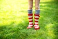 Image of child legs wearing red rain boots