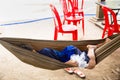 Image of a child resting in a hammock. Royalty Free Stock Photo