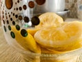 Lemons inside a glass pitcher