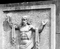 Image of Christ with symbolic gestures on the tombstone