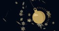 Image of christmas bauble dangling with snowflakes falling on black background