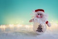 Image of christmas bauble with santa claus in front of pastel blue background Royalty Free Stock Photo